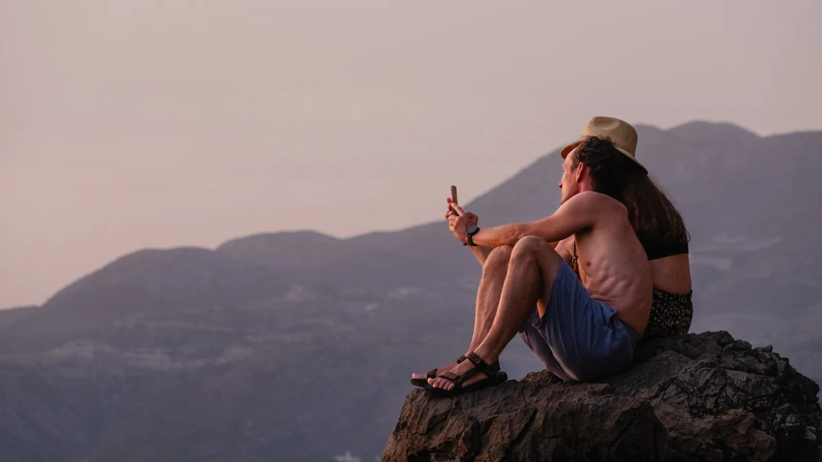 Two people overlooking the coast